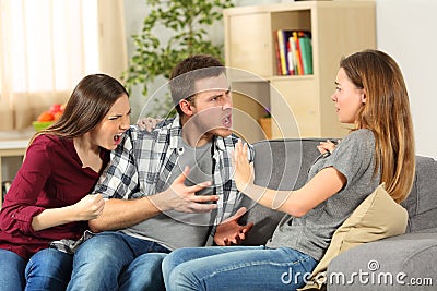 Roommates arguing and shouting at home Stock Photo