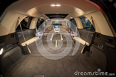 roomy empty interior of premium suv. rear seats folded in flat flor in luxury expencive suv car Stock Photo