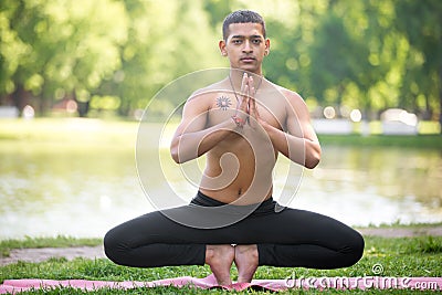 Root Chakra Pose variation Stock Photo