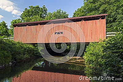 Root Covered Bridge Reflection Stock Photo