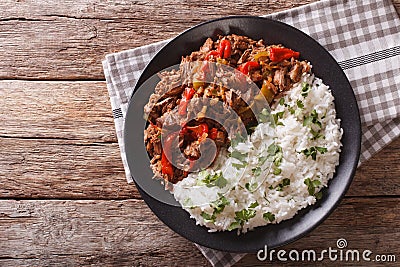 Ropa vieja: beef stew in tomato sauce with vegetables and rice. Stock Photo