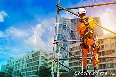 Rope access and abseiling in construction site Stock Photo