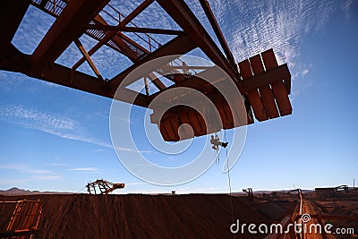 Rope access worker inspector wearing fall safety harness working abseiling in rope transfer position Stock Photo