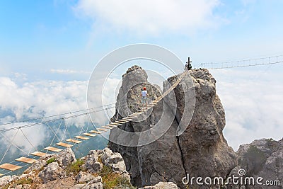 Rope bridge over the chasm Stock Photo