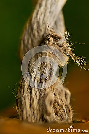 Rope going through wood shooted with macro lens Stock Photo