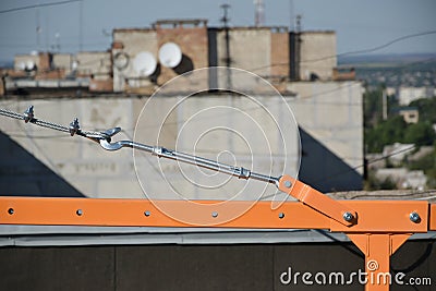 Rope lockers in rear beam of suspended wire rope platform for facade works on high multistorey buildings. Rope lockers blocks kink Stock Photo