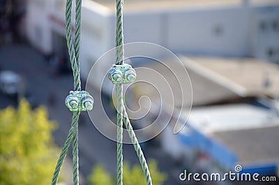 Rope lockers in of suspended wire rope platform for facade works on high multistorey buildings. Rope lockers blocks kink for Stock Photo