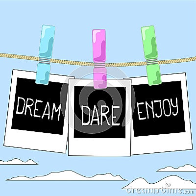 Rope with photo frames on cloudy sky background. Motivation words Dream, Dare, Enjoy on instant photos. Stock Photo