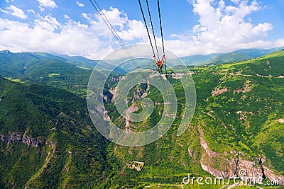 Ropes of the aerial cableway to the sights of the Orthodox monastery Tatev in the mountains Stock Photo