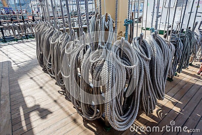 Ropes on a deck of a sailing ship. Equipment of sailing boat and ship`s exterior Stock Photo