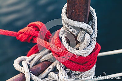 Ropes in different colors tied at the front yacht Stock Photo