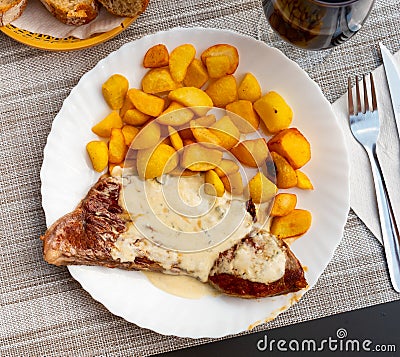 Roquefort veal steak served with fried potato Stock Photo