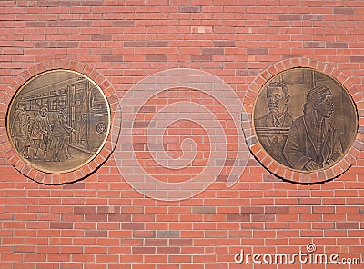 Plaquettes describing the Montgomery bus boycott on a red brick wall in Montgomery, Alabama Stock Photo