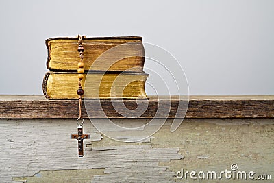 Rosary beads and books of Catholic Church liturgy Stock Photo