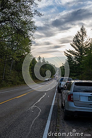 Roscommon MI - September 18, 2021:Vehicles parks on crowded rural road Editorial Stock Photo