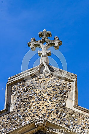 Rose cross on the roof of St Maryâ€™s Church in Ware with gargoyle Stock Photo