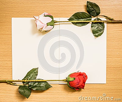 Rose flowers arrangements on book white page Stock Photo