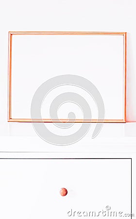Rose gold frame on white furniture, luxury home decor and design for mockup, poster print and printable art, online shop Stock Photo