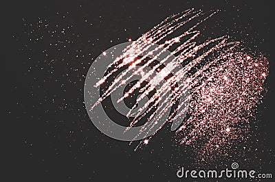 Rose gold glitter on black background for your design Stock Photo