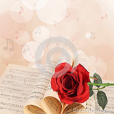 The rose on notebooks with notes Stock Photo