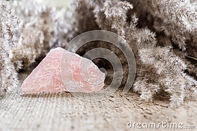 Rose quartz mineral specimen on wooden background Stock Photo