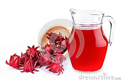 Fresh Jamaica sorrel flower Rozelle, roselle or hibiscus sabdariffa in wooden bowl and glass pitcher jug of roselle juice tea Stock Photo