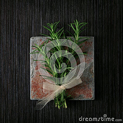 Rosemary bound on slate kitchen sideboard background, shabby chic Stock Photo