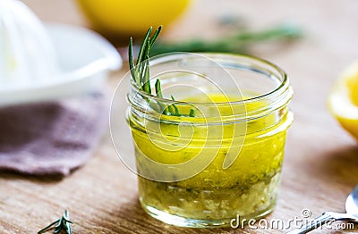 Rosemary and garlic lemon salad dressing Stock Photo