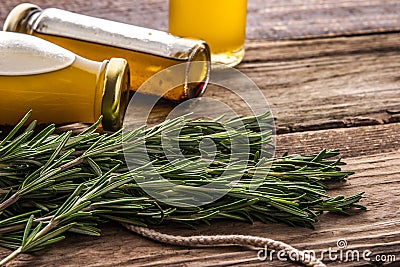 Rosemary and olive oil in the wooden table horizontal Stock Photo