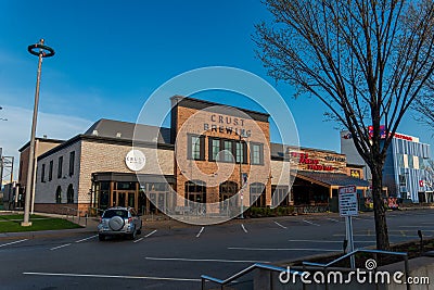 Rosemont, IL - APRIL 23, 202 : Outside the Crust Brewing Business a micro brewery Editorial Stock Photo