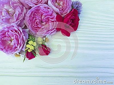 roses beautiful bouquet daisy birthday border season frame on a white wooden background Stock Photo