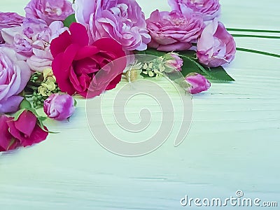 roses beautiful bouquet daisy birthday season frame on a white wooden background Stock Photo