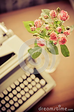 Roses and old type-writer Stock Photo