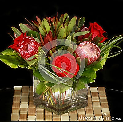 Roses and Proteas Flower Arrangement Stock Photo