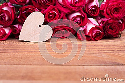 Roses, wooden heart, free space Stock Photo