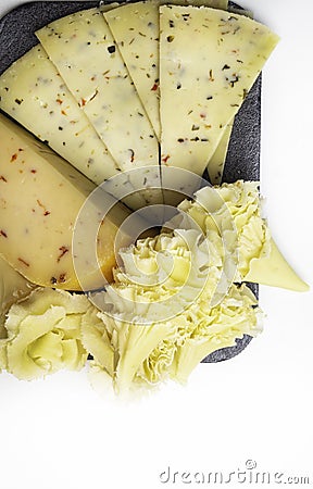 Rosette Closeup of Swiss Cheese Tete de Moine, and cheese with herbs Stock Photo