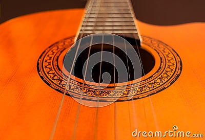 Rosette and strings of an acoustic guitar close up. Classical Spanish guitar. Musical instrument Stock Photo