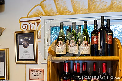 Wine bottles in a store at the entrance to the Tel Shilo Archaeological Site in Samaria region in Benjamin district, Israel Editorial Stock Photo