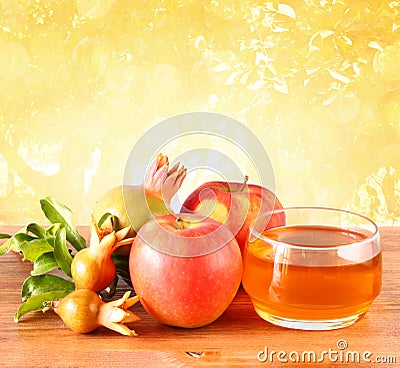Rosh hashanah concept - apple honey and pomegranate over wooden table Stock Photo