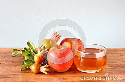 Rosh hashanah concept - apple honey and pomegranate over wooden table. Stock Photo