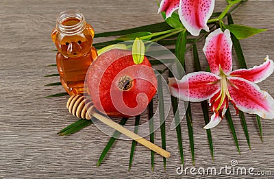 rosh hashanah jewesh holiday concept - pomegranate honey pink lilies jewish food, symbol, Stock Photo