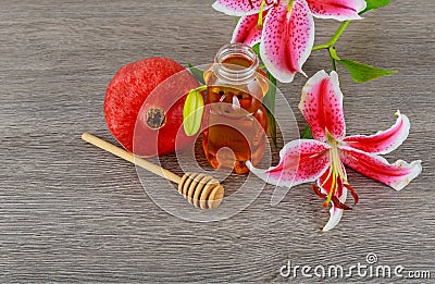 rosh hashanah jewesh holiday concept - pomegranate honey pink lilies jewish food, symbol, Stock Photo