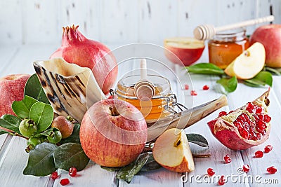 Rosh hashanah - jewish New Year holiday concept. Traditional symbols: Honey jar and fresh apples with pomegranate and shofar- horn Stock Photo