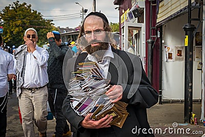 Rosh Hashanah, Jewish New Year 5777. During the mass holiday, the Hasid pilgrim sells religious literature. Editorial Stock Photo