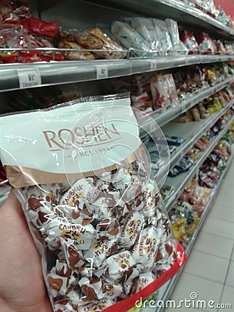 Roshen chocolate candies in hand Editorial Stock Photo