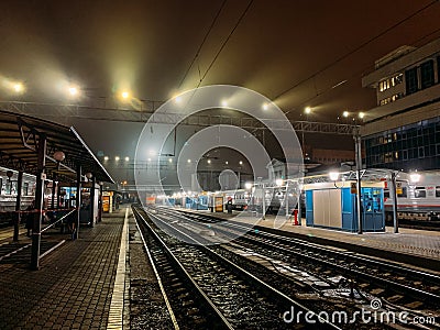 Rostov-on-Don, Russia - Circa November 2018 : Railways Station of RZD in Rostov-on-Don at night, Passenger train and platform Editorial Stock Photo