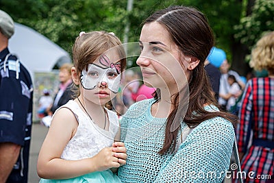 ROSTOV-ON-DON, RUSSIA - 20 May, 2018. Festival Ball of Babies. A beautiful little girl and in a festive dress and carnival mask Editorial Stock Photo