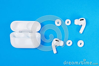 Rostov, Russia - July 06, 2020: Comfortable charging wireless headphones Apple AirPods Pro, open case and soft, flexible silicone Stock Photo