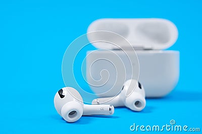 Rostov, Russia - July 06, 2020: Wireless headphones Apple AirPods Pro in opened charging case with active noise Editorial Stock Photo