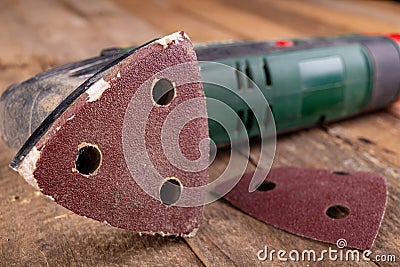 Rotary wood grinder with old sandpaper. Work tool in a carpentry workshop Stock Photo